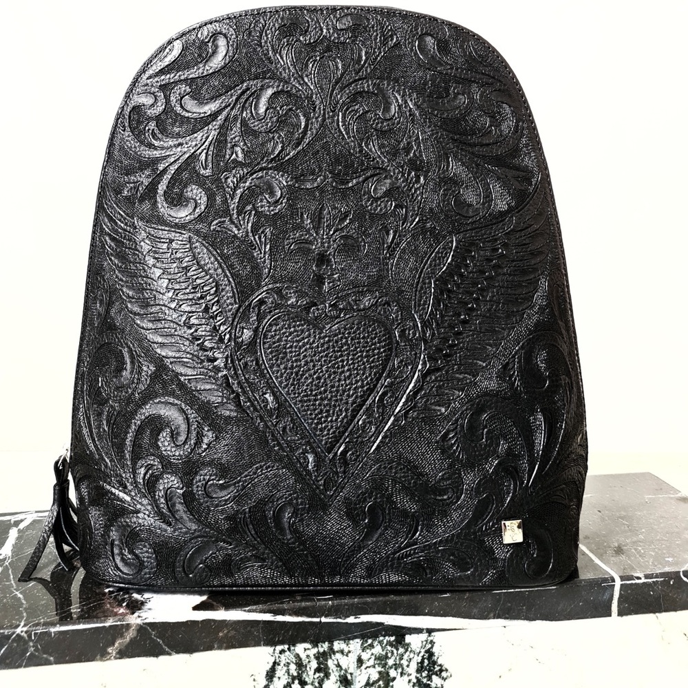 Carolina Crowley Chiseled leather backpack